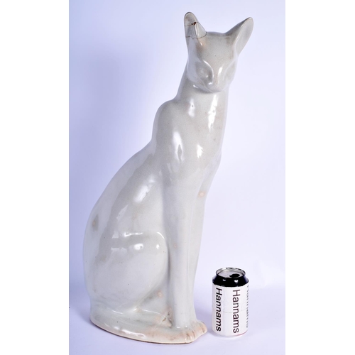 100 - A 1950S HEALS POTTERY FIGURE OF A SEATED CAT of elegant form. 54 cm x 20 cm.