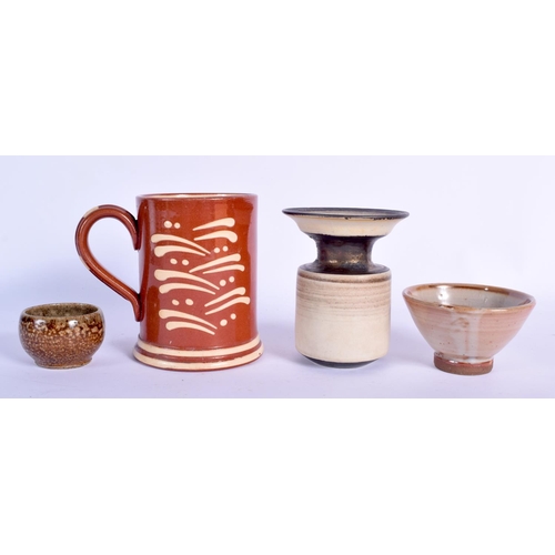 101 - A SLIP DECORATED HOKANA TREACLE GLAZED TANKARD together with three other studio pottery vessels. Lar... 