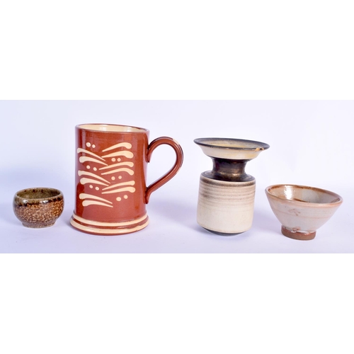 101 - A SLIP DECORATED HOKANA TREACLE GLAZED TANKARD together with three other studio pottery vessels. Lar... 