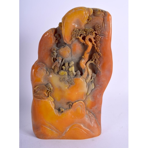 1024 - A CHINESE CARVED ORANGE SOAPSTONE MOUNTAIN. 22 cm x 12 cm.