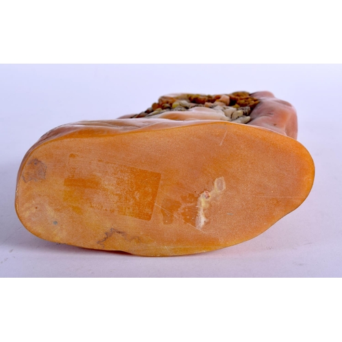 1024 - A CHINESE CARVED ORANGE SOAPSTONE MOUNTAIN. 22 cm x 12 cm.