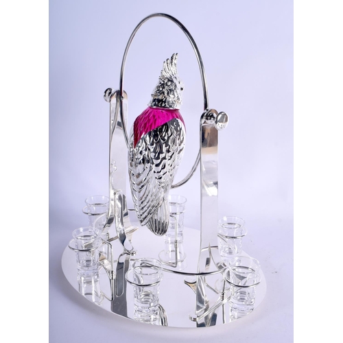 1032 - A LARGE CONTINENTAL SILVER PLATED RUBY GLASS DECANTER SET modelled as a swinging bird. 3390 grams. 4... 