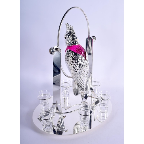 1032 - A LARGE CONTINENTAL SILVER PLATED RUBY GLASS DECANTER SET modelled as a swinging bird. 3390 grams. 4... 