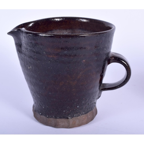 104 - A ST IVES STUDIO POTTERY JUG and a St Ives plate. Largest 14 cm wide. (2)