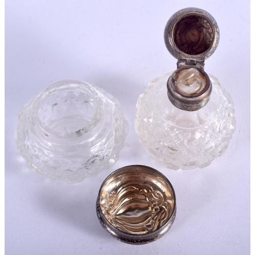 1050 - A SILVER TOPPED SCENT BOTTLES TOGETHER WITH A JAR AND COVER.  Hallmarked Birmingham 1901 and 1902, S... 