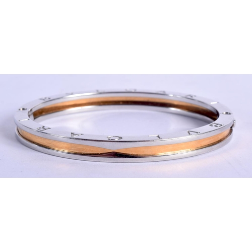 1058 - BULGAR STEEL AND GOLD BRACELET.  6.7cm x 5.5cm (internal), weight 29g