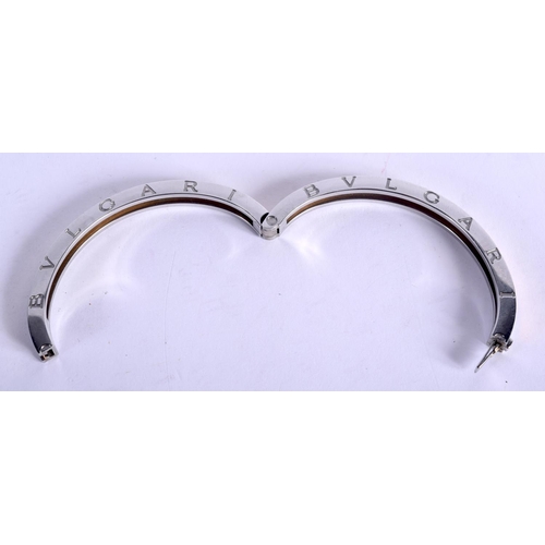 1058 - BULGAR STEEL AND GOLD BRACELET.  6.7cm x 5.5cm (internal), weight 29g