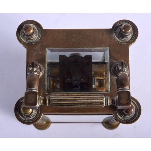 1083 - A BRASS CARRIAGE CLOCK.  13.5cm high (16.1cm with handle raised) x 8.5cm x 7cm with key