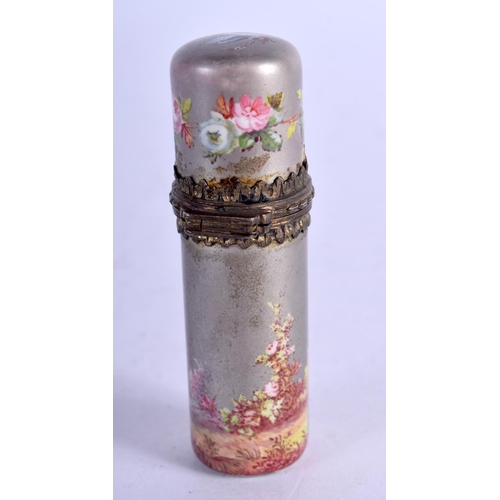 1103 - A CONTINENTAL SILVER AND ENAMEL SCENT BOTTLE DECORATED WITH A ROMANTIC SCENE