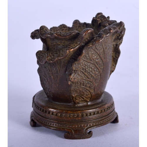 1109 - A BRONZE LEAF SHAPED CAULDRON WITH AN INSECT ON TOP.  4.8cm x 4.2cm, weight 102.6g