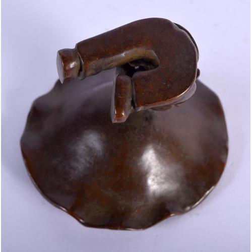 1112 - A JAPANESE BRONZE BOY HOLDING ALOFT A LILY PAD.  6.1cm X 6.3cm, weight 120.1g