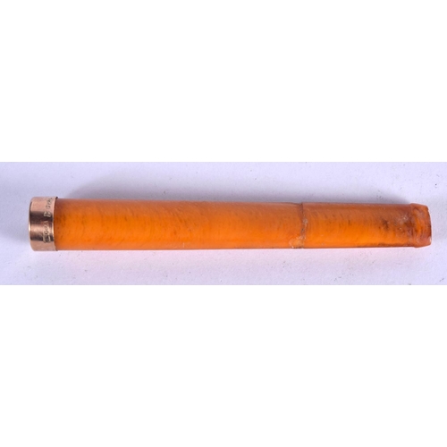 1115 - A CASED GOLD MOUNTED AMBER CHEROOT HOLDER.  Stamped 925, Holder 9.4cm x 1.3cm, weight 8.3g