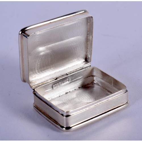 1125 - A STERLING SILVER PILL BOX  DECORATED WITH A GOLFER.  Stamped Sterling, 2.6cm x 3.2cm, weight 21g