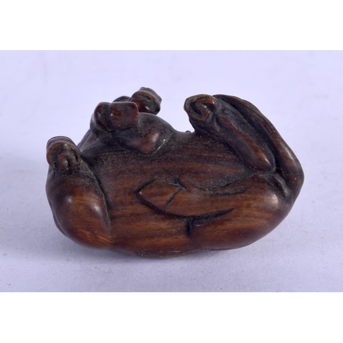 1131 - A JAPANESE WOOD NETSUKE IN FOR FORM OF A HORSE WITH A MONKEY ON ITS BACK.  4.4cm x 4.4cm, weight 24.... 