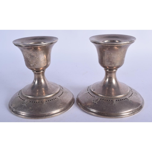 1173 - A PAIR OF VINTAGE SILVER CANDLESTICKS. 548 grams. 12 cm x 12 cm.