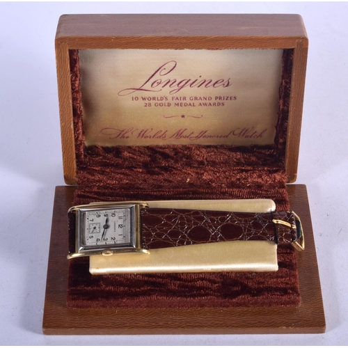 1214 - A VINTAGE GOLD LONGINES WRISTWATCH. 27 grams. 2.5 cm wide inc crown.