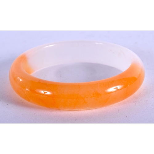 1234 - A TWO TONE JADE BANGLE.  Inner diameter 6cm, weight 53.7g