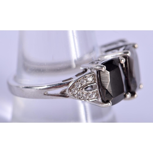 1240 - A SILVER RING INSET WITH BLACK STONES.  Stamped 925, size R/S, weight 4.8g