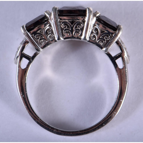 1240 - A SILVER RING INSET WITH BLACK STONES.  Stamped 925, size R/S, weight 4.8g