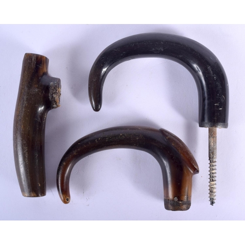 185 - A 19TH CENTURY MIDDLE EASTERN CARVED RHINOCEROS HORN HANDLE together with two other buffalo horn han... 