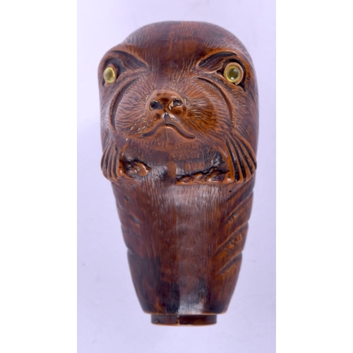 187 - TWO BLACK FOREST STYLE CANE HANDLES one formed as a seal, the other as a dog. Largest 9 cm x 7 cm. (... 