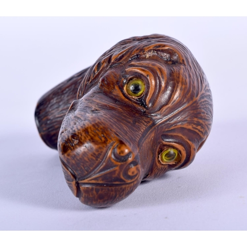 187 - TWO BLACK FOREST STYLE CANE HANDLES one formed as a seal, the other as a dog. Largest 9 cm x 7 cm. (... 