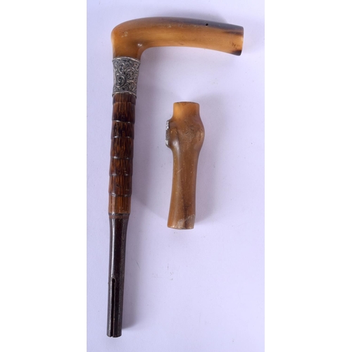188 - TWO 19TH CENTURY MIDDLE EASTERN CARVED RHINOCEROS HORN CANE HANDLES one with silver mounts. Largest ... 