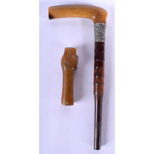 188 - TWO 19TH CENTURY MIDDLE EASTERN CARVED RHINOCEROS HORN CANE HANDLES one with silver mounts. Largest ... 