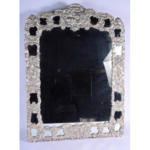 192 - A VERY LARGE 19TH CENTURY CONTINENTAL WHITE METAL OVERLAID COUNTRY HOUSE MIRROR decorated with birds... 