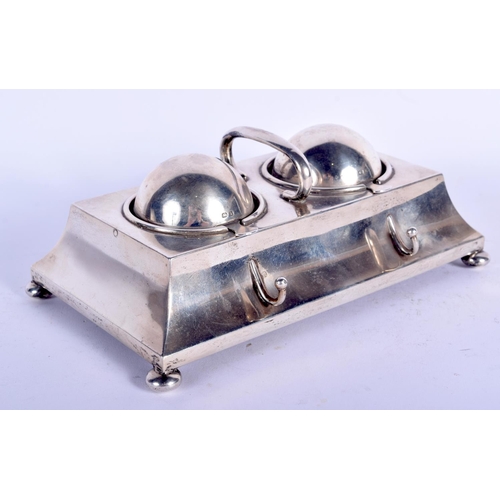 193 - AN EDWARDIAN SILVER RECTANGULAR DESK INK STAND with domed revolving top, supported upon bun feet. 89... 