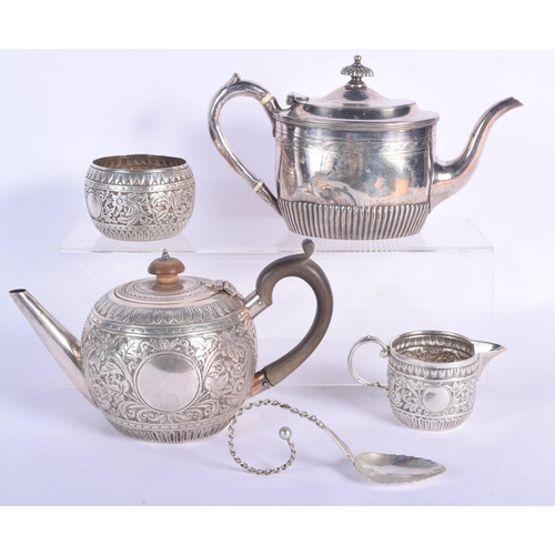 195 - AN EDWARDIAN SILVER BULLET FORM TEAPOT AND COVER with similar sucrier and cream jug, together with a... 