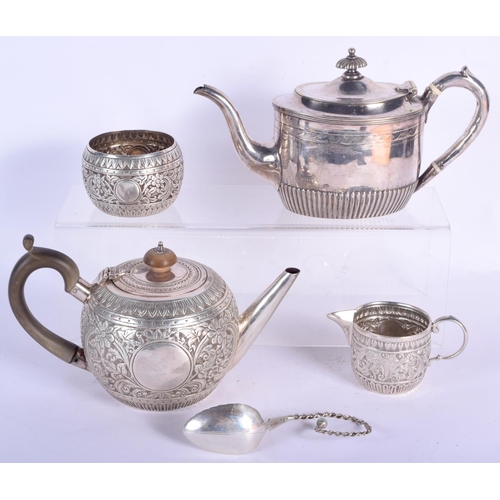 195 - AN EDWARDIAN SILVER BULLET FORM TEAPOT AND COVER with similar sucrier and cream jug, together with a... 