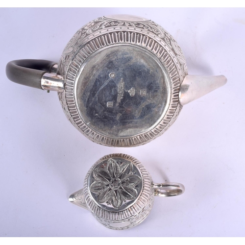 195 - AN EDWARDIAN SILVER BULLET FORM TEAPOT AND COVER with similar sucrier and cream jug, together with a... 