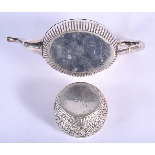 195 - AN EDWARDIAN SILVER BULLET FORM TEAPOT AND COVER with similar sucrier and cream jug, together with a... 