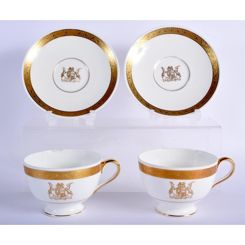 199 - 20th c. Minton pair of breakfast size teacup and saucers gilded with a crest Cup 7.5cm High, Saucer ... 