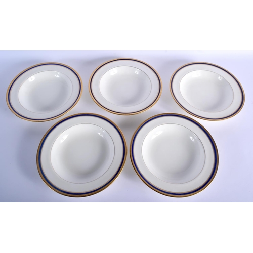 203 - 20th c.  Minton dinner plate and two dessert plates with crimson border having a crown and lion cres... 