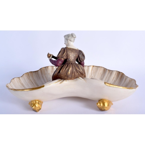 212 - Royal Worcester rare shell dish with four shell feet having a girl seated in the centre playing an i... 
