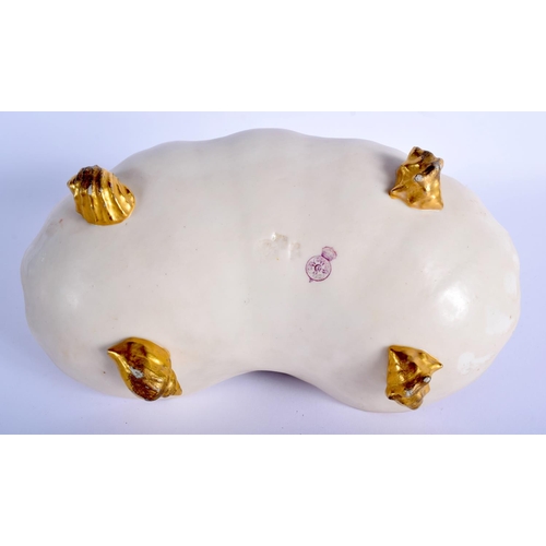 212 - Royal Worcester rare shell dish with four shell feet having a girl seated in the centre playing an i... 