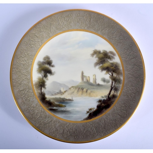 228 - Royal Worcester rare 'embossed leather' bordered plate painted with a ruins scene by a river by G. J... 