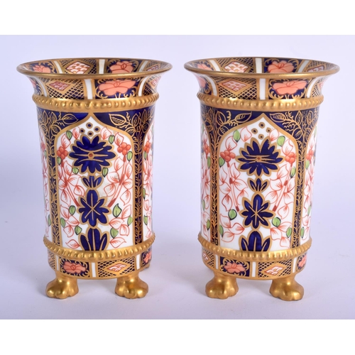 282 - Royal Crown Derby pair of four footed spill vases painted in imari pattern 1128 date code for 1907. ... 
