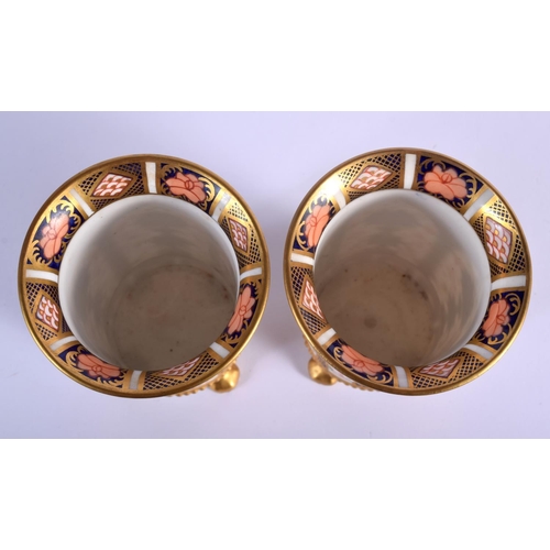 282 - Royal Crown Derby pair of four footed spill vases painted in imari pattern 1128 date code for 1907. ... 