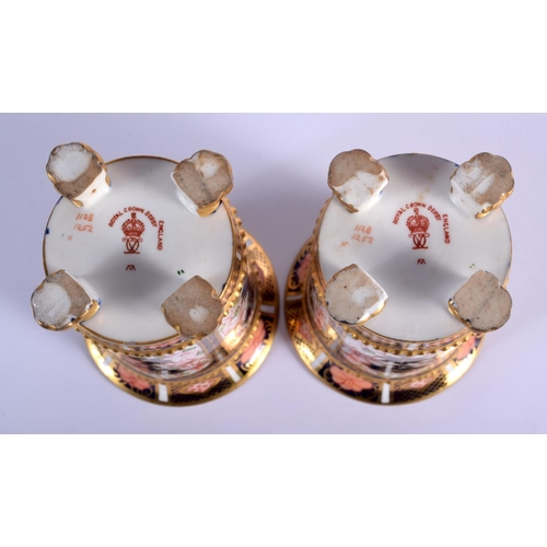 282 - Royal Crown Derby pair of four footed spill vases painted in imari pattern 1128 date code for 1907. ... 