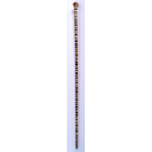 296 - A 19TH CENTURY MIDDLE EASTERN ANGLO INDIAN RHINOCEROS AND BUFFALO HORN WALKING CANE. 90 cm long.