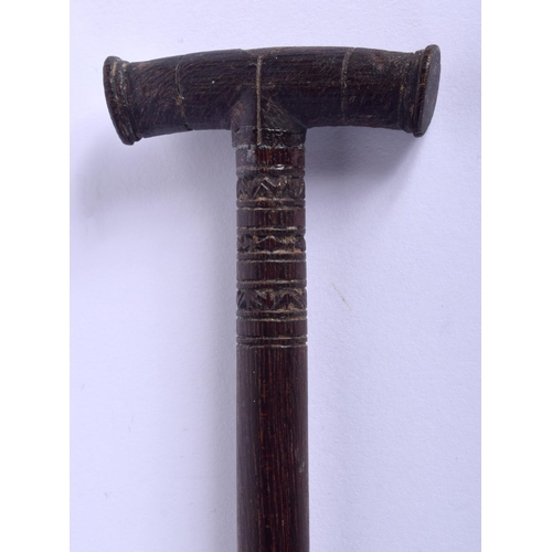 299 - AN AUSTRALIAN TRIBAL PADDLE together with a boomerang. Largest 50 cm long. (2)