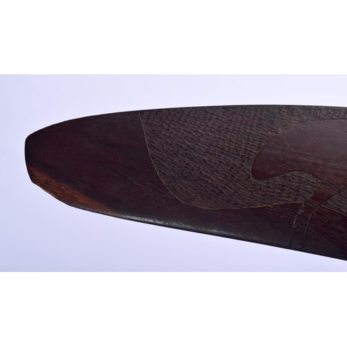 299 - AN AUSTRALIAN TRIBAL PADDLE together with a boomerang. Largest 50 cm long. (2)