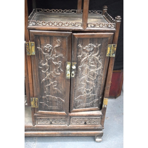 334 - AN EARLY 20TH CENTURY CHINESE CARVED HARDWOOD DISPLAY CABINET Late Qing/Republic. Length 90cm, Width... 