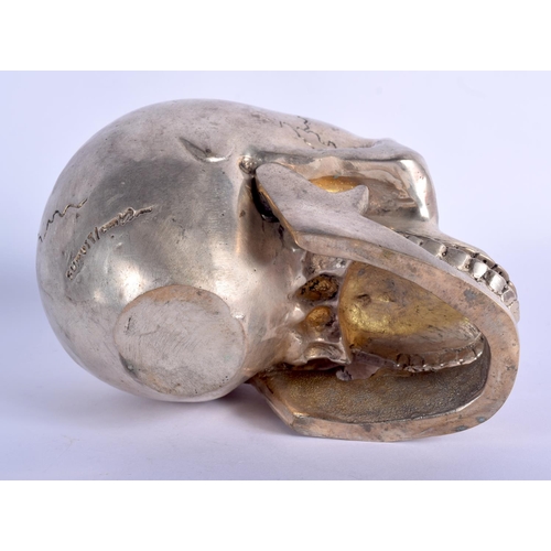 339 - A SILVER PLATED SKULL. 14 cm x 11 cm.