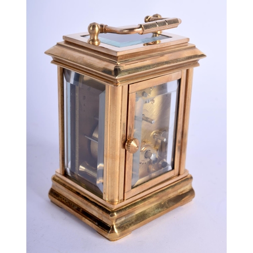 373 - A CONTEMPORARY BRASS CARRIAGE CLOCK. 9.5 cm high inc handle.
