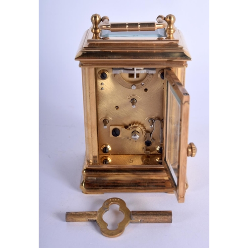 373 - A CONTEMPORARY BRASS CARRIAGE CLOCK. 9.5 cm high inc handle.