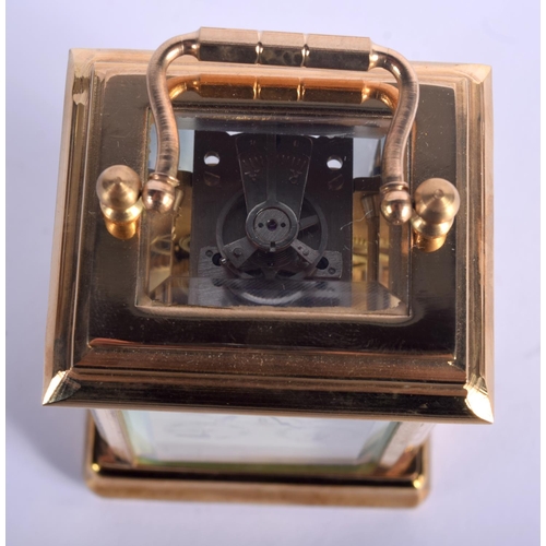 373 - A CONTEMPORARY BRASS CARRIAGE CLOCK. 9.5 cm high inc handle.